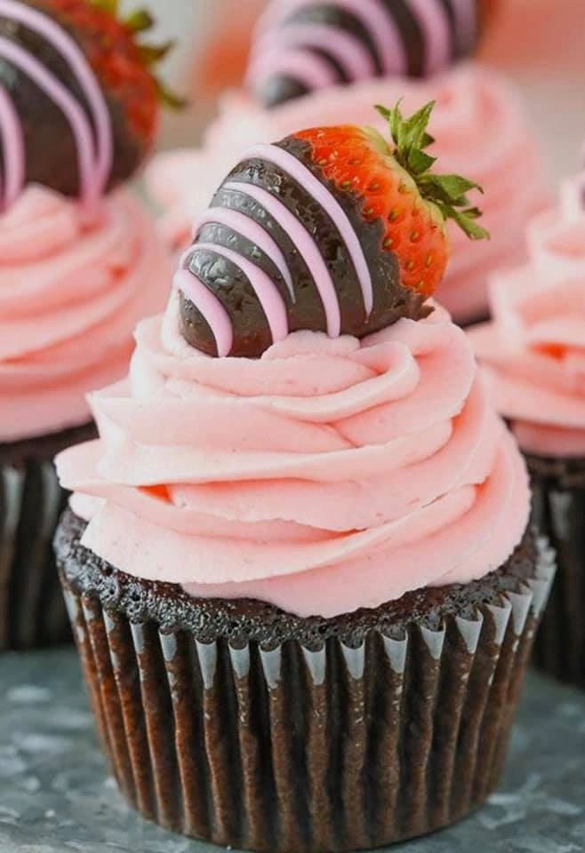 Strawberry cupcakes topped with chocolate-covered strawberries by Becca Bakes