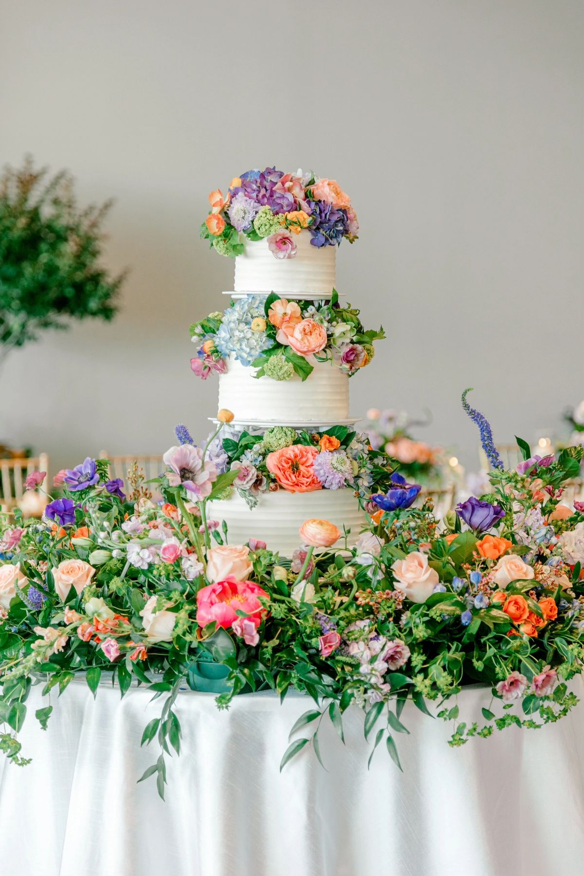 Elegant tiered wedding cake with fresh florals by Becca Bakes, Owensboro KY