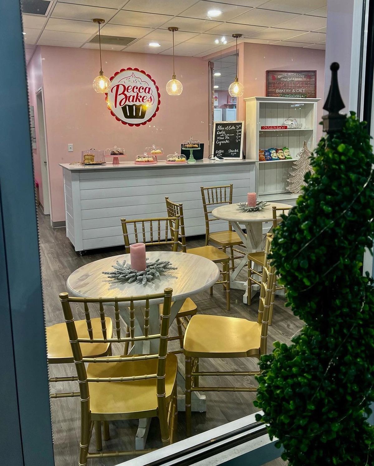Becca Bakes party room in Owensboro set with gold chairs